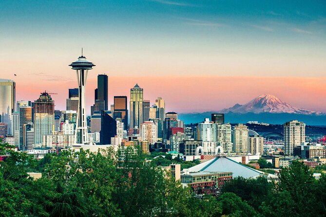 The Seattle skyline at dusk with Mount Rainier behind it
